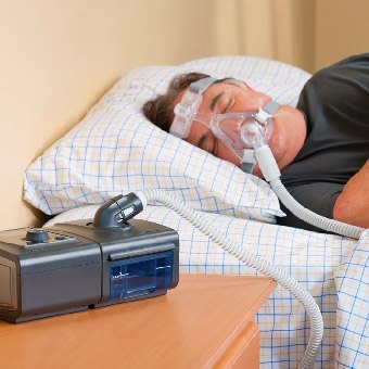 Man with BiPAP mask in place