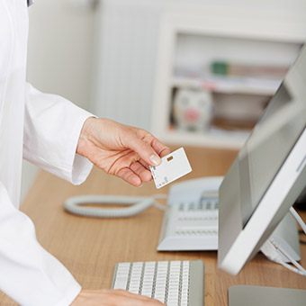 Dental team member reviewing insurance