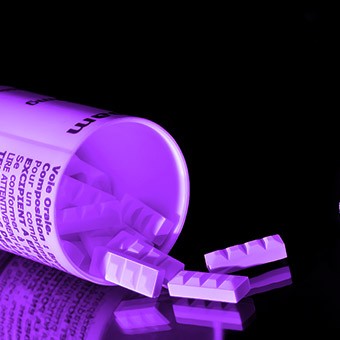 bottle of purple pills