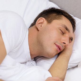 Man in bed sleeping soundly