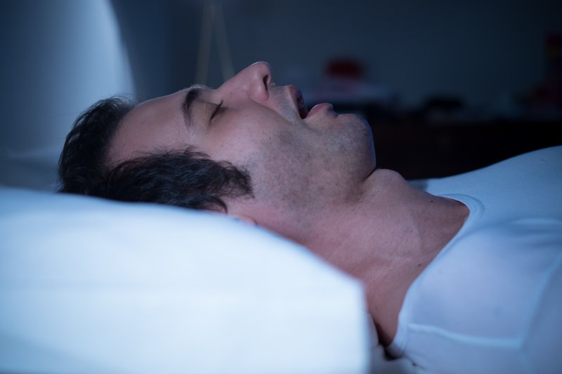 a man sleeping with his mouth open 