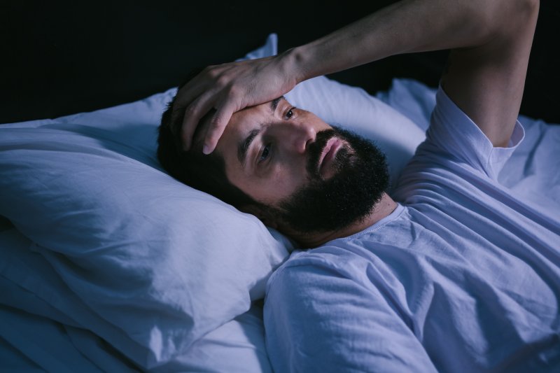 man having trouble sleeping 