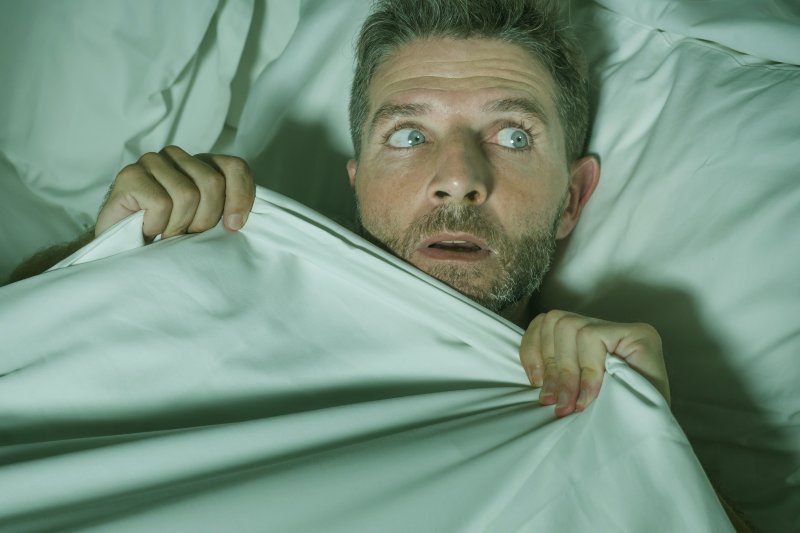 man waking after having a nightmare