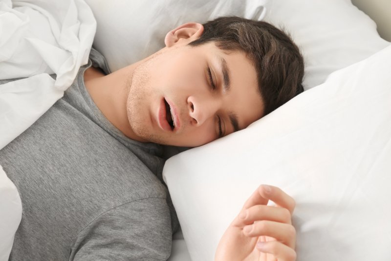 young male asleep with mouth open